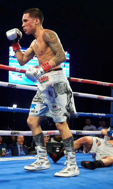 Valdez defends WBO title in 1st fight since breaking jaw
